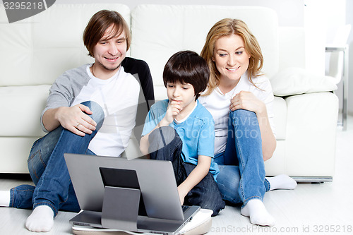 Image of Young parents with children