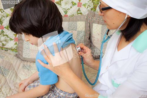 Image of doctor with stethoscope and boy