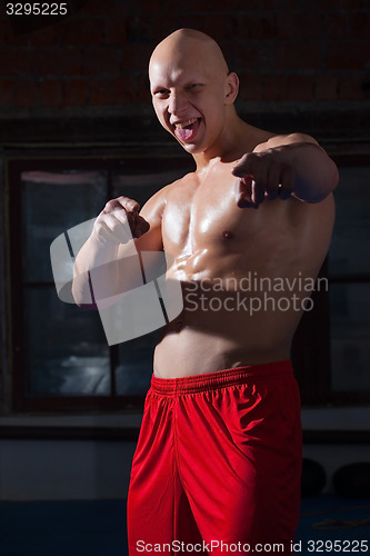 Image of Russian boxer in red shorts