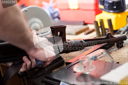 Image of repair of the old German submachine gun MP-38