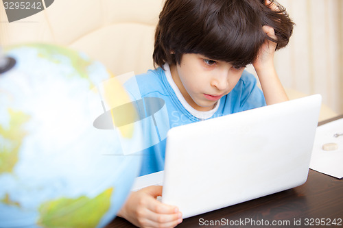 Image of boy with computer