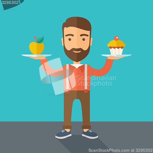 Image of Man carries with his two hands cupcake and apple.