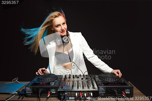 Image of Beautiful blonde DJ girl on decks - the party,