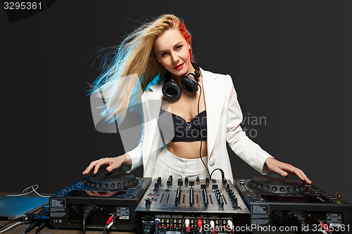 Image of Beautiful blonde DJ girl on decks - the party,