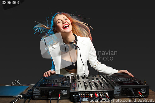 Image of Beautiful blonde DJ girl on decks - the party,