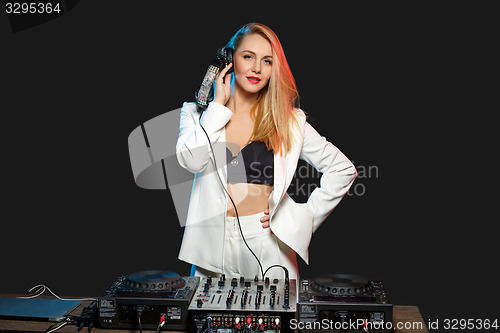 Image of Beautiful blonde DJ girl on decks - the party,