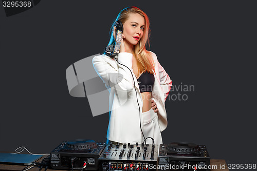 Image of Beautiful blonde DJ girl on decks - the party,