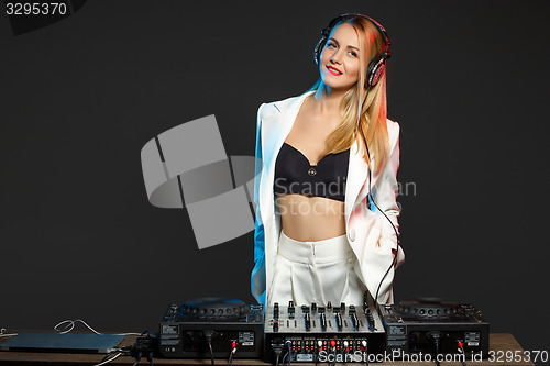 Image of Beautiful blonde DJ girl on decks - the party,