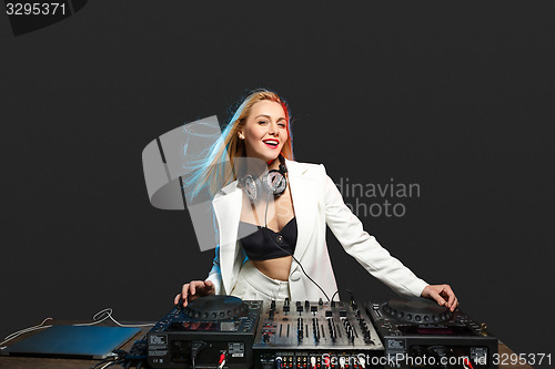 Image of Beautiful blonde DJ girl on decks - the party,