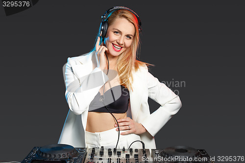 Image of Beautiful blonde DJ girl on decks - the party,