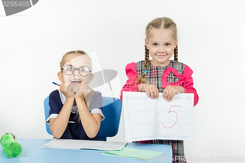 Image of Happy schoolgirl received five