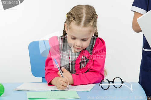 Image of First-grader a lesson at school