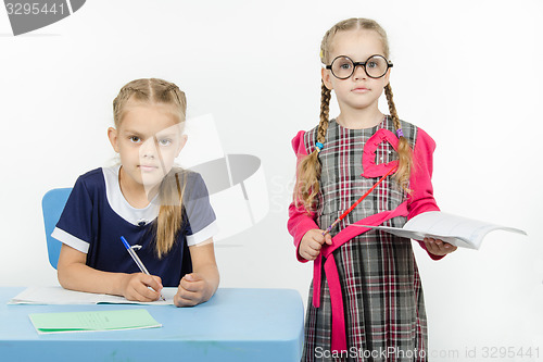 Image of Children playing in the teacher and student