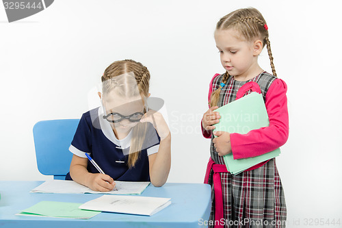 Image of The girl went to desk other girls