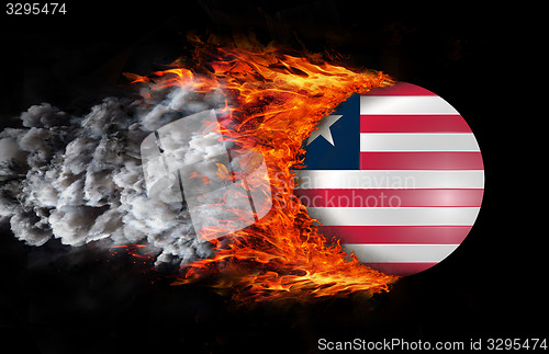 Image of Flag with a trail of fire and smoke - Liberia