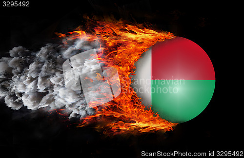 Image of Flag with a trail of fire and smoke - Madagascar