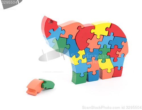 Image of Colorful puzzle pieces in elephant shape