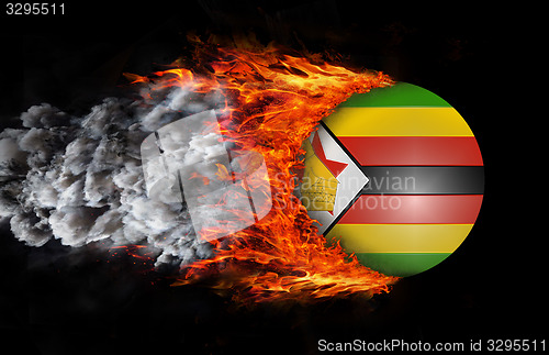 Image of Flag with a trail of fire and smoke - Zimbabwe