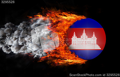 Image of Flag with a trail of fire and smoke - Cambodia