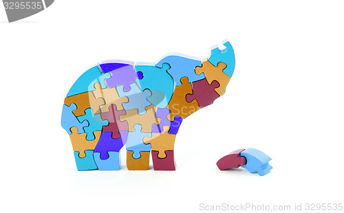 Image of Colorful puzzle pieces in elephant shape