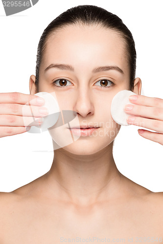 Image of skin care woman removing face with cotton swabs