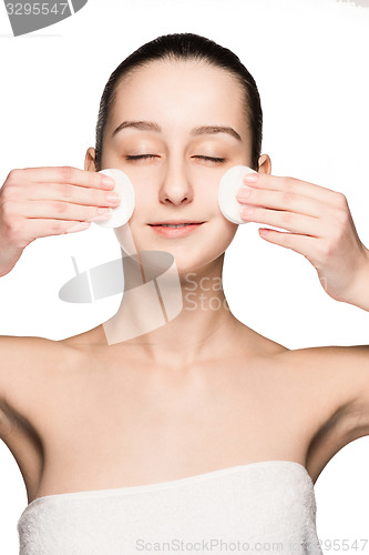 Image of skin care woman removing face with cotton swabs