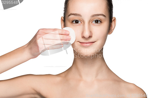 Image of skin care woman removing face with cotton swab pad