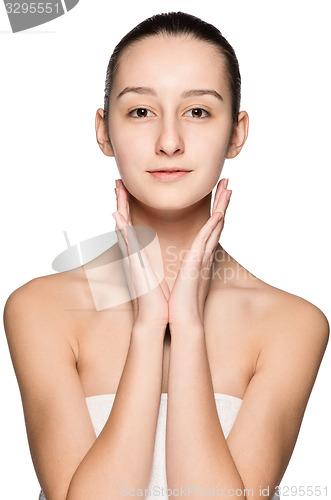 Image of Portrait of beautiful girl stroking her face with healthy skin 