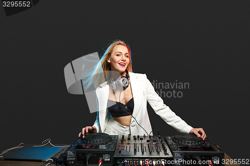 Image of Beautiful blonde DJ girl on decks - the party,