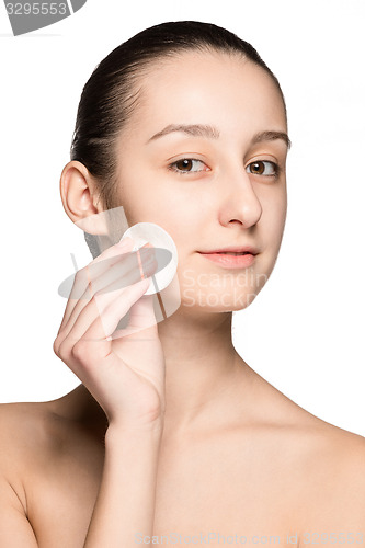 Image of skin care woman removing face with cotton swab pad