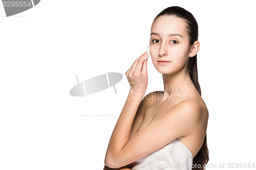 Image of skin care woman removing face with cotton swab pad
