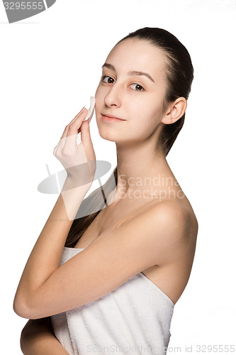 Image of skin care woman removing face with cotton swab pad