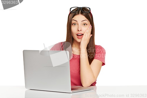 Image of Surprised girl with laptop