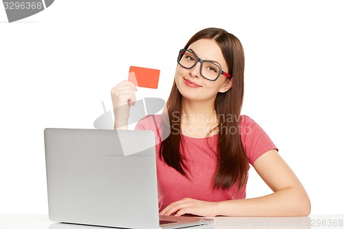 Image of smiling businesswoman with laptop and credit card