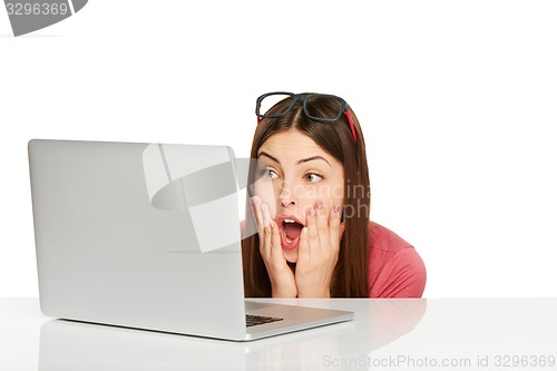 Image of Surprised girl with laptop