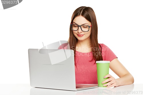 Image of smiling businesswoman with laptop and credit card