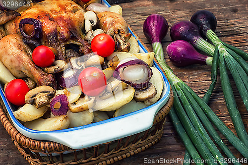 Image of delicious chicken baked potato and fresh vegetables