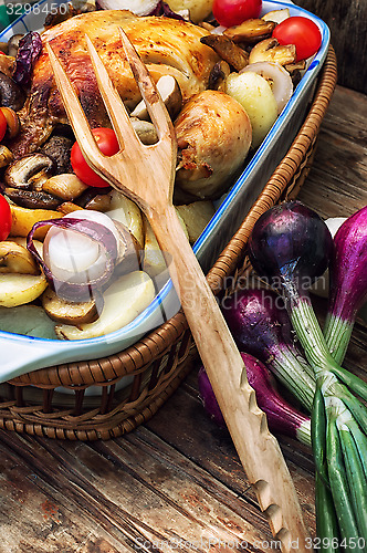 Image of delicious chicken baked potato and fresh vegetables