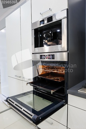 Image of Modern hi-tek kitchen, oven with door open