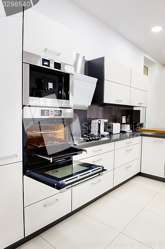 Image of Modern hi-tek kitchen, oven with door open