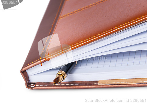 Image of Closeup fountain pen located inside the notebook