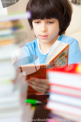 Image of boy reading a book