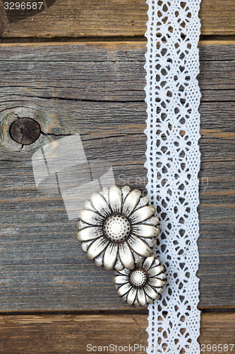 Image of vintage metal buttons flowers and lace ribbons