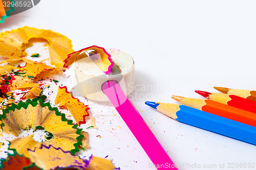 Image of set of colored pencils, sharpener and shavings 