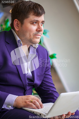 Image of businessman with laptop