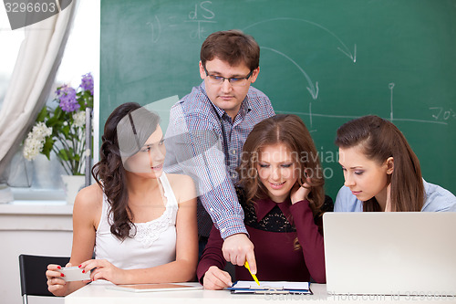 Image of teacher and students