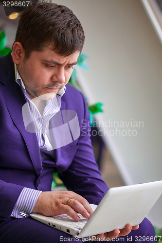 Image of businessman with laptop