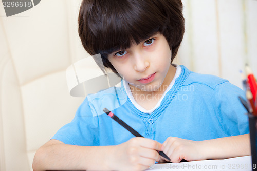 Image of schoolboy doing homework