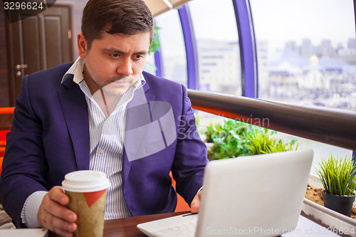 Image of businesswoman working on a computer