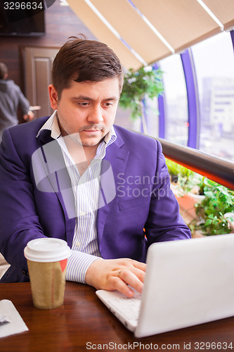 Image of businessman working on a computer